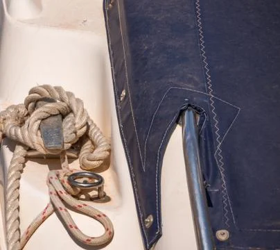 Dock cleat on the side of a boat in a small marina, an element of yachting eq Stock Photos