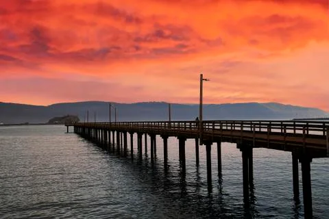 Dock extends out into the harbor of Crescent City Stock Photos