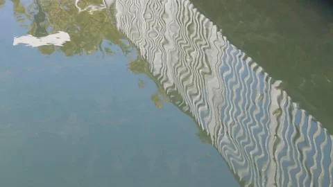 Dock fence reflection on water Stock-Footage 96726234