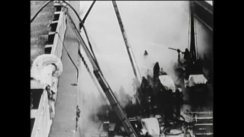 A dock fire includes the Cunard Line cruise ship building and firefighters climb Vídeos de archivo 146470067