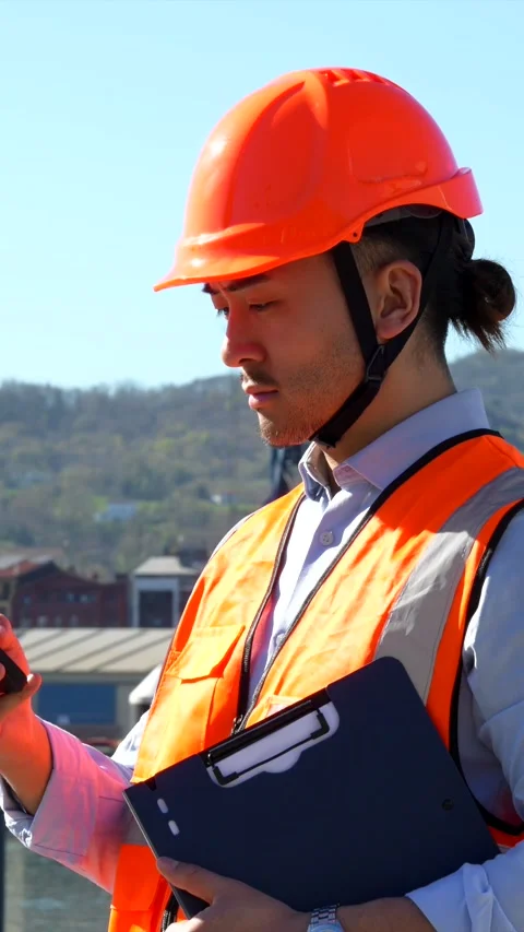 Dock foreman supervising cargo operations at the port Stock Footage 333731397