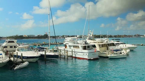 Dock full of ocean sea craft tied up. Boats leaving and returning A Stock Footage 112143654