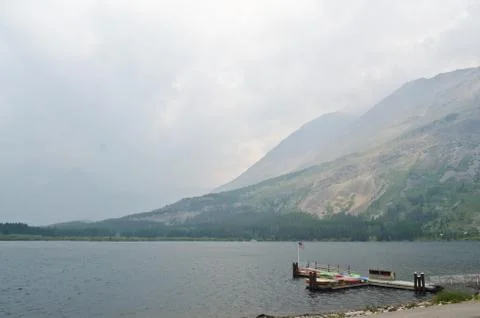 Dock on lakeshore. Stock Photos