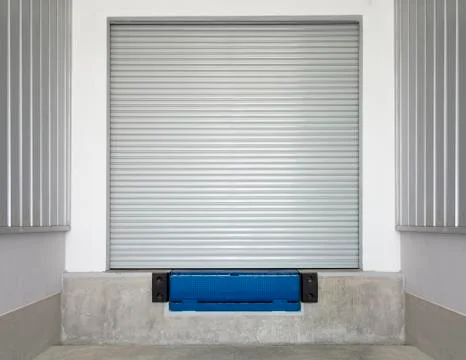 Dock leveler and shutter door Stock Photos