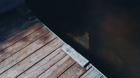 A dock over murky water 스톡 동영상 75596941