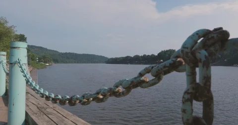 Dock Overlooking River with Rusty Chain Railing Vídeos de archivo 92321555