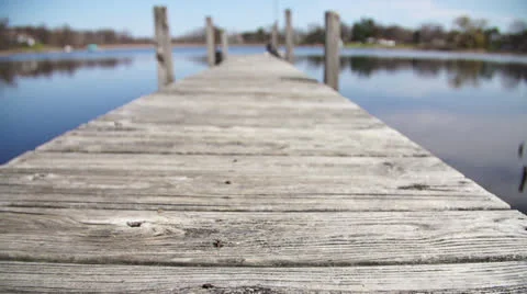 Dock on Peaceful Pond Stock Footage 22957940