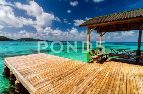 Dock in Turquoise Water Stock Photos
