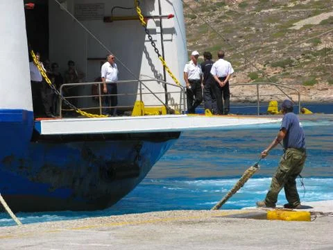 Dock worker in action Stock Photos
