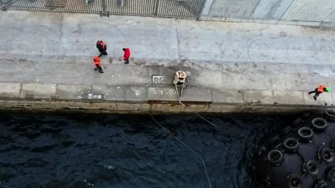 Dock Workers Assisting Cruise Ship Arrival at Port in Gibraltar Stock Footage 334835030