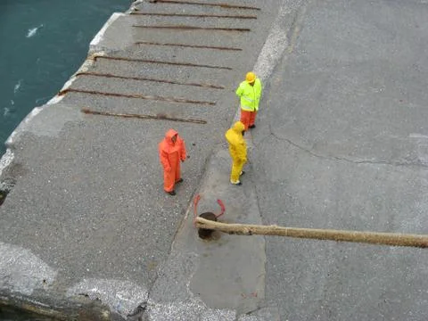 Dock workers waiting Stock Photos