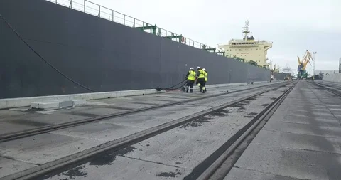 Dock Workers Working An Industrial Port Stock Footage 104083270