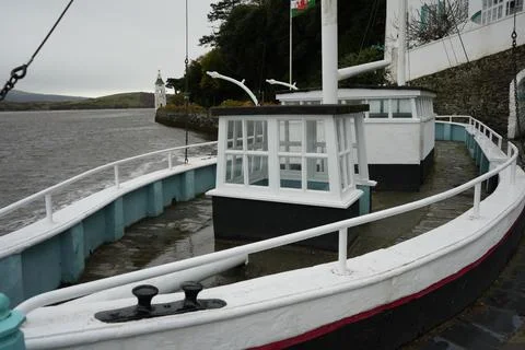 Docked Boat-like Structure By Water, Portmeirion Lighthouse, North Wales, Cloudy Stock Photos
