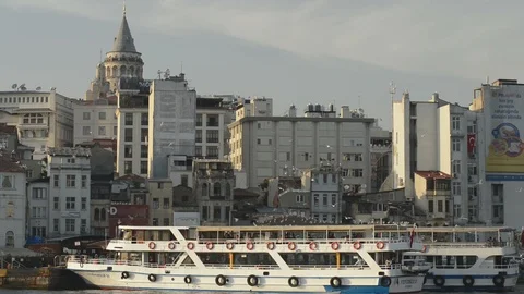Docked ferry in foreground with Galata tower in background Stock Footage 90712564