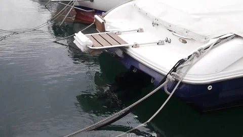 Docked ship swinging in marina Stock Footage