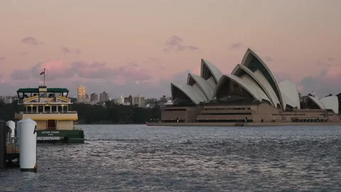 Docked Sydney ferry around Sunset with Opera House in background 4K Video stock 157854219