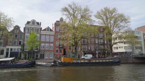 The docking boat on the side of the big canal Stock Footage 78644510