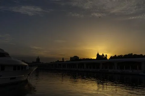 The docking harbour of Malaga with sun set in the background in Malaga, Spain Stock Photos