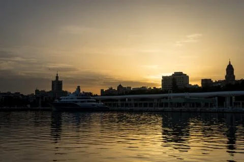 The docking harbour of Malaga with sun set in the background in Malaga, Spain Foto stock