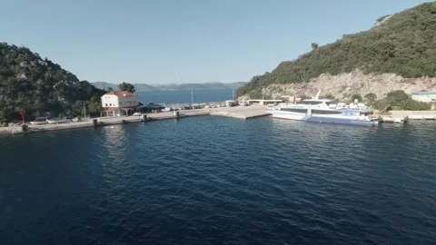 Docking to island port Stock Footage 242864089