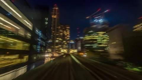 The Docklands in London from a fast moving train at night, POV hyperlapse Stock Footage