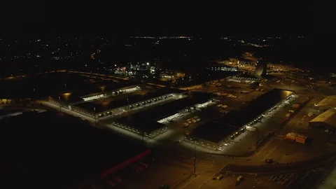 Docks at dark night. Drone flying over warehouse and containers on the Stockbeeldmateriaal 116203908