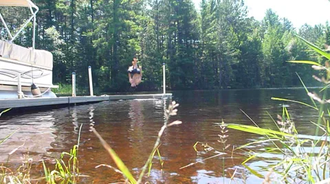 Dockside Flip into Lake 2 Stock Footage 27246219