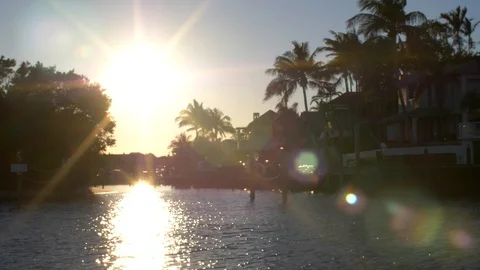 Dockside Housed from Boat at Sunset Stock Footage 93748297