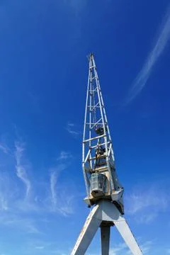 Dockyard crane pointing to the sky Stock Photos