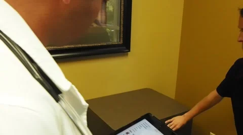 Docotor with tablet taking inventory Stock Footage 56354295