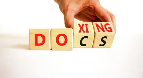 Docs or doxing symbol. Concept words Docs Doxing on wooden block. Beautiful.. Stock-Fotos