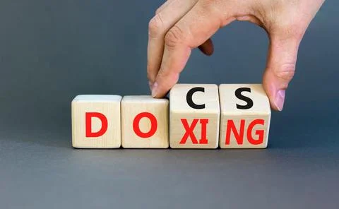 Docs or doxing symbol. Concept words Docs Doxing on wooden block. Beautiful.. Stock Photos