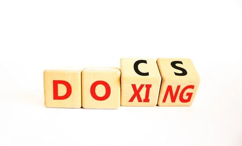 Docs or doxing symbol. Concept words Docs Doxing on wooden block. Beautiful.. Stock-Fotos