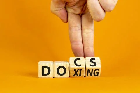Docs or doxing symbol. Concept words Docs Doxing on wooden block. Beautiful.. Foto stock