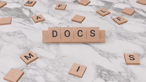 Docs word written on scrabble Stock Footage 256393438