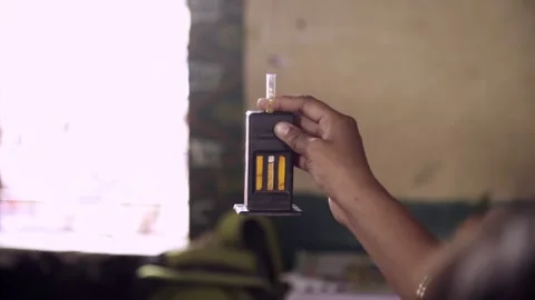 Docter is using Sahli's hemoglobinometer to check its concentration in blood Stock Footage 162077729