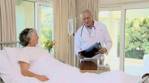 Docteur showing a radio to his patient Stock Footage