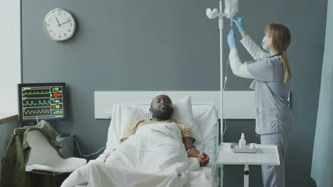 Doctor Adding Medication To IV Bag Stock Footage 234403910
