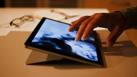 Doctor analyzing medical data on touchscreen computer Stock Footage 93621750