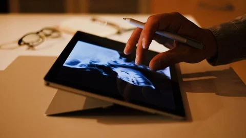 Doctor analyzing medical data on touchscreen computer Stock Footage 93621827