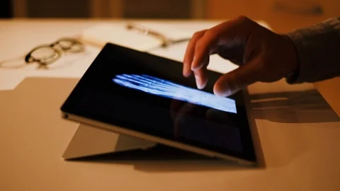 Doctor analyzing medical data on touchscreen computer Stock Footage 93621940