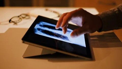 Doctor analyzing medical data on touchscreen computer Stock Footage 93622032