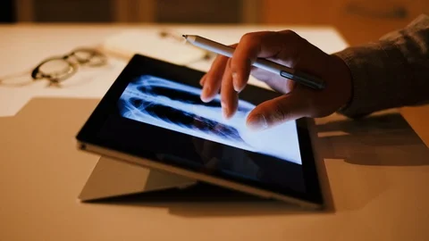 Doctor analyzing medical data on touchscreen computer Stock Footage 93622080