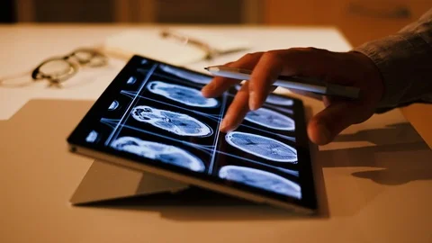 Doctor analyzing medical data on touchscreen computer Stock Footage 93622134
