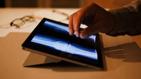 Doctor analyzing medical data on touchscreen computer Stock Footage 93622159