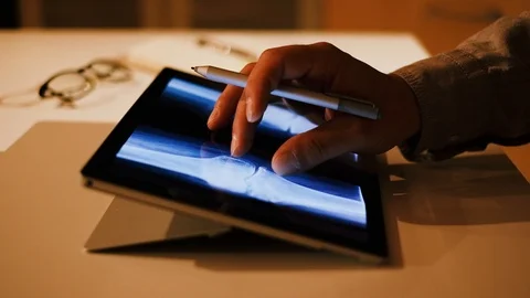 Doctor analyzing medical data on touchscreen computer Stock Footage 93622176