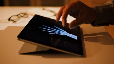 Doctor analyzing medical data on touchscreen computer Stock Footage 93622194