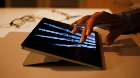 Doctor analyzing medical data on touchscreen computer Stock Footage 93622239