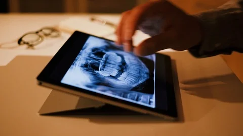 Doctor analyzing medical data on touchscreen computer Stock Footage 93622257