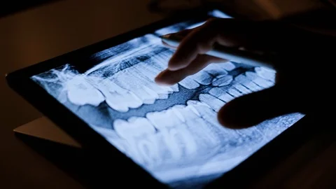 Doctor analyzing medical data on touchscreen computer Stock Footage 93622604